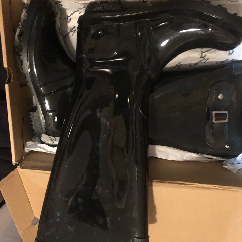 Like new! Rain/snow boots. Never worn just tried on and walked around house.